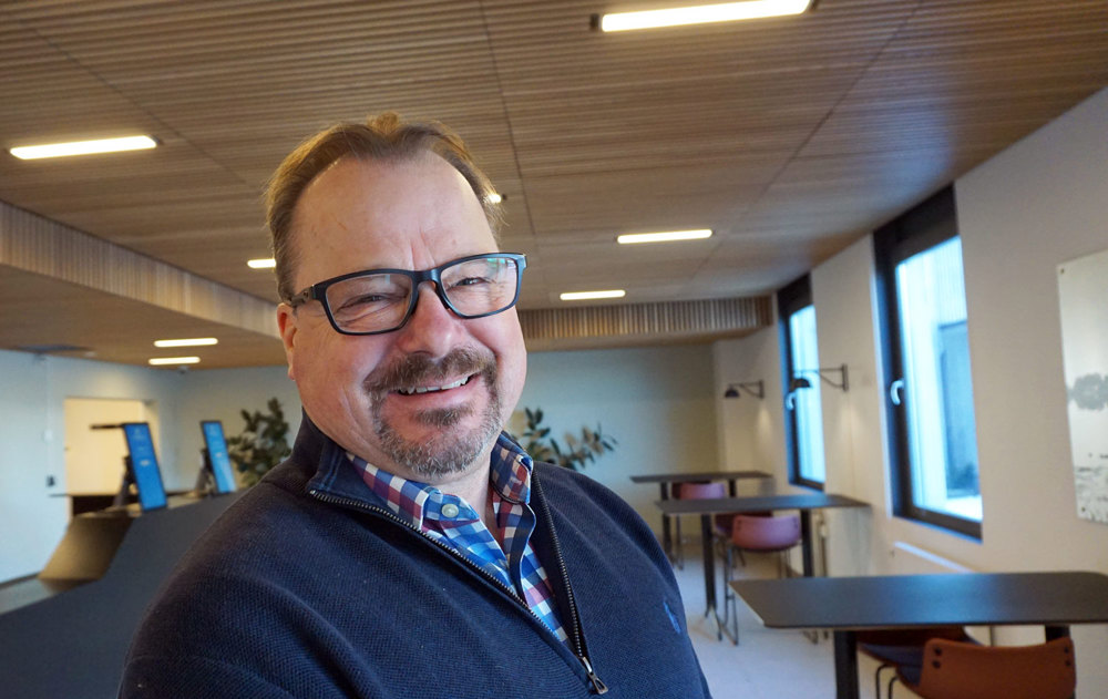 portrait of man, posing, reception area.
