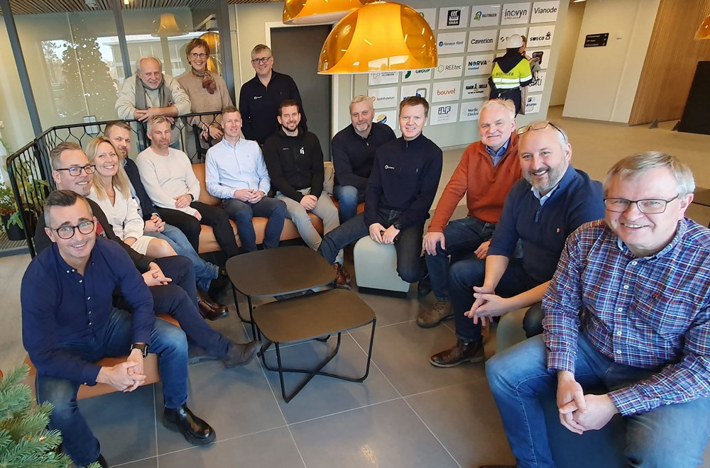 15 people sitting in a furnitured area, reception