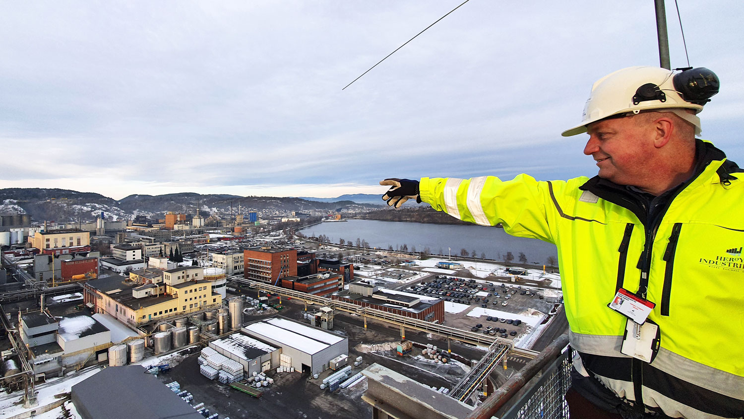 man standing on top of building pointing with finger 