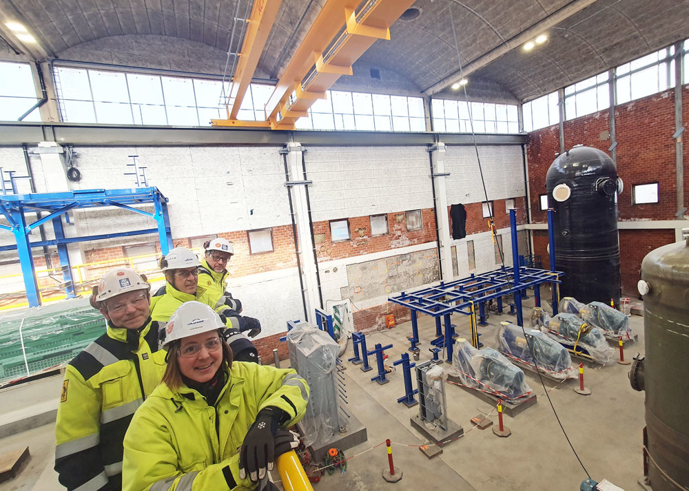 four people posing, industry hall