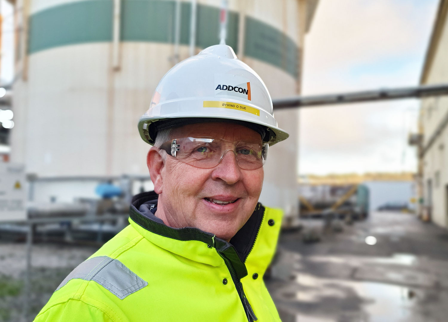 Portrait of man, helmet, outdoors, industry