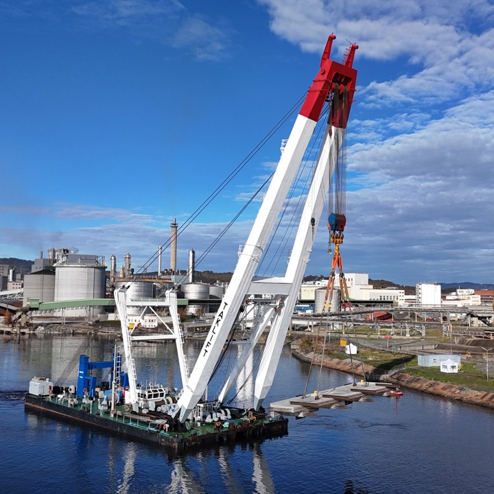 giant crane on a barge, crane vessel, lifing big concrete elements