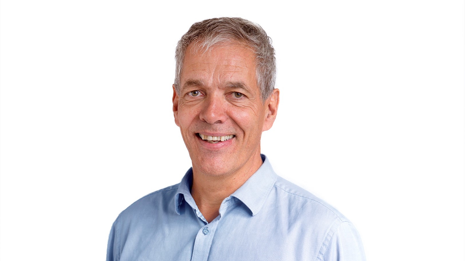 portrait of man in light blue shirt